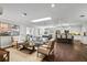 A bright open-concept living room flows into a stylish kitchen and dining area at 230 S Ranger Blvd, Winter Park, FL 32792