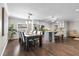 A dining space adjoins a kitchen with stainless steel appliances and a central island at 230 S Ranger Blvd, Winter Park, FL 32792