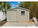 Exterior shot of a shed with beige siding and a single window at 230 S Ranger Blvd, Winter Park, FL 32792