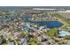 Gorgeous aerial view of a neighborhood featuring waterfront houses and beautiful mature trees and landscaping at 2509 Chapala Dr, Kissimmee, FL 34746