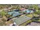 Overhead shot of community amenities including tennis courts, basketball courts, pool, and lush landscaping at 2509 Chapala Dr, Kissimmee, FL 34746