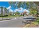 View of the community gate with meticulously maintained grounds showcasing the secured entrance at 2509 Chapala Dr, Kissimmee, FL 34746