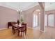 Inviting dining room featuring wood floors, a chandelier, and large windows at 2509 Chapala Dr, Kissimmee, FL 34746