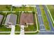 Aerial view of the house showing roof, lawn, and community streets at 2601 Gold Dust Cir, Kissimmee, FL 34744