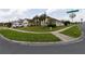 Landscaped corner lot featuring a well-kept lawn, mature trees, and attractive curb appeal at 2601 Gold Dust Cir, Kissimmee, FL 34744