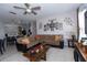 Bright, airy living room adjoining kitchen, featuring tile flooring, and comfortable seating at 2601 Gold Dust Cir, Kissimmee, FL 34744