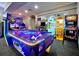 Fun-filled arcade featuring air hockey and various gaming machines for entertainment at 2774 Almaton Loop # 101, Kissimmee, FL 34747