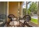 Relaxing balcony with comfortable wicker chairs and a view of the surrounding landscape at 2774 Almaton Loop # 101, Kissimmee, FL 34747