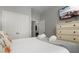 Bright bedroom features a queen bed, dresser and closet at 2774 Almaton Loop # 101, Kissimmee, FL 34747