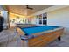 Outdoor billiard room with multiple pool tables and seating, perfect for community socializing at 2774 Almaton Loop # 101, Kissimmee, FL 34747