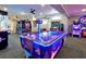 Vibrant game room with air hockey, video games, and a welcoming atmosphere for fun at 2774 Almaton Loop # 101, Kissimmee, FL 34747