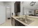 Well-lit kitchen features stainless steel appliances and light countertops at 2774 Almaton Loop # 101, Kissimmee, FL 34747