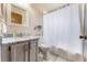 Cozy bathroom with a shower curtain and a vanity with a stylish countertop at 3043 Autumn Run Ct, Orlando, FL 32822