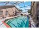 Relaxing screened-in pool with comfortable outdoor seating, ideal for backyard enjoyment at 3043 Autumn Run Ct, Orlando, FL 32822