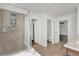 Well-lit bathroom featuring a shower, bathtub, and modern fixtures at 3179 Turret Dr, Kissimmee, FL 34743