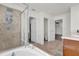 Well-lit bathroom featuring a shower, bathtub, and modern fixtures at 3179 Turret Dr, Kissimmee, FL 34743