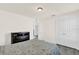 Bright bedroom features a dark dresser and closet with gray wood-look floors at 3179 Turret Dr, Kissimmee, FL 34743