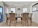 Bright dining room featuring a modern light fixture and seating for six at 3179 Turret Dr, Kissimmee, FL 34743