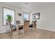 Bright dining room featuring a modern light fixture and seating for six at 3179 Turret Dr, Kissimmee, FL 34743