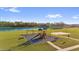 Aerial view of neighborhood playground and basketball court by the lake at 3179 Turret Dr, Kissimmee, FL 34743