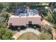 A bird's eye view displaying a home with a screen enclosed pool, patio, and circular driveway at 3431 Dawn Ct, Lake Mary, FL 32746