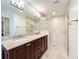 Updated bathroom showcasing double sink vanity and a frameless glass shower at 3431 Dawn Ct, Lake Mary, FL 32746