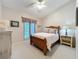 Cozy bedroom featuring neutral carpet, a wood bed frame, and a ceiling fan at 3431 Dawn Ct, Lake Mary, FL 32746