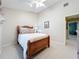 Cozy bedroom featuring neutral carpet, a wood bed frame, and a ceiling fan at 3431 Dawn Ct, Lake Mary, FL 32746