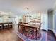 Dining room featuring a large wooden table, elegant chandelier, and built-in cabinets at 3431 Dawn Ct, Lake Mary, FL 32746