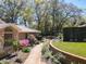 Manicured front garden and brick path to home's front entrance and garage at 3431 Dawn Ct, Lake Mary, FL 32746