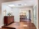 Foyer leading to the dining room with hardwood floors, skylight, and custom woodwork at 3431 Dawn Ct, Lake Mary, FL 32746