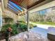 Covered front porch with stone flooring, a decorative fountain, and views of the driveway and surrounding landscape at 3431 Dawn Ct, Lake Mary, FL 32746