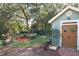 Charming potting shed with double doors and a decorative sun and dragonfly at 3431 Dawn Ct, Lake Mary, FL 32746