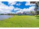 Spacious backyard with a waterfront view and mature trees surrounding the property at 372 Rest Haven Rd, Geneva, FL 32732