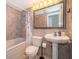 Cozy bathroom featuring a jacuzzi tub and pedestal sink at 372 Rest Haven Rd, Geneva, FL 32732