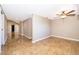 Bedroom with tiled floors and a ceiling fan with an entrance hall on the side at 372 Rest Haven Rd, Geneva, FL 32732