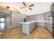 A stylish kitchen featuring grey cabinets, an island, and stainless steel appliances at 372 Rest Haven Rd, Geneva, FL 32732