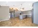 Spacious kitchen featuring gray cabinets, an island, and tile floors at 372 Rest Haven Rd, Geneva, FL 32732