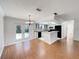 Open dining area with french doors leading to backyard pool and patio at 5030 Creekview Ln, Lakeland, FL 33811