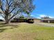 Charming single-story home with a well-manicured lawn and a two-car garage at 5030 Creekview Ln, Lakeland, FL 33811