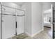 Bathroom featuring a glass-enclosed shower with white tile and decorative accents at 5283 Wildwood Way, Davenport, FL 33837