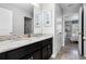 Bathroom features double sinks with granite countertops and tile floors with access to the bedroom at 5283 Wildwood Way, Davenport, FL 33837