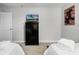 Neutral bedroom featuring a dresser with television, carpet flooring, and twin beds at 5283 Wildwood Way, Davenport, FL 33837