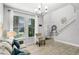 Bright living room with tile floors, neutral tones, and natural light at 5283 Wildwood Way, Davenport, FL 33837