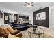 Spacious living room featuring dark accent wall and open-concept design at 5283 Wildwood Way, Davenport, FL 33837