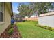 View of a spacious backyard with a screened-in patio, wooden fence, and shed at 600 Statenville Ct, Ocoee, FL 34761