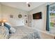 Bedroom featuring neutral walls, ceiling fan, and access door to the outside at 600 Statenville Ct, Ocoee, FL 34761