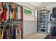 Spacious walk-in closet with custom shelving and ample storage space at 600 Statenville Ct, Ocoee, FL 34761