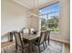 Elegant dining room featuring a modern chandelier and large windows at 600 Statenville Ct, Ocoee, FL 34761