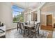 Elegant dining room featuring a modern chandelier and large windows at 600 Statenville Ct, Ocoee, FL 34761